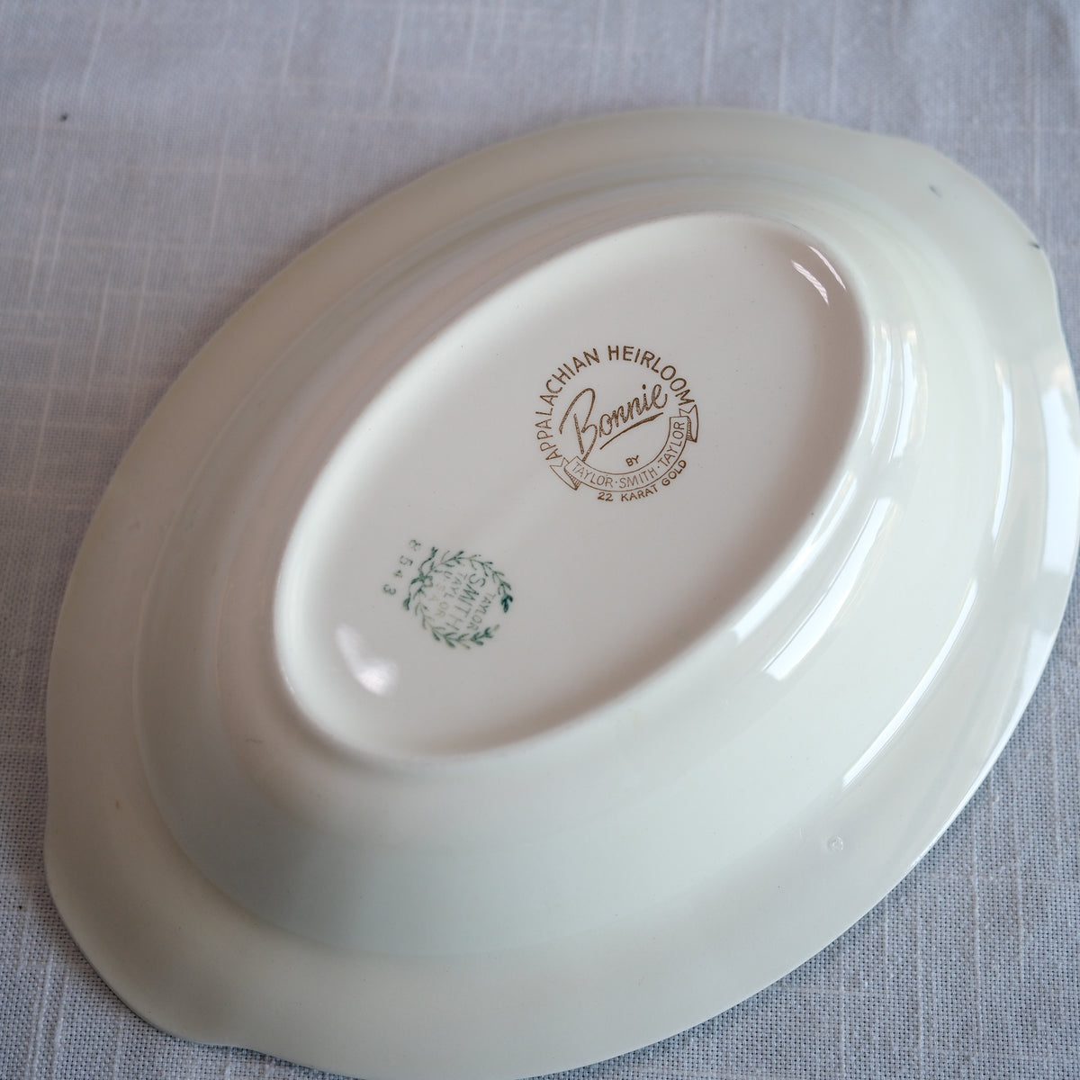 Vintage "Appalachian Heirloom" Oval Serving Bowl Hunter Green Gold Edged Bonnie Pattern - Taylor, Smith, & Taylor Pottery Company 9.5x7