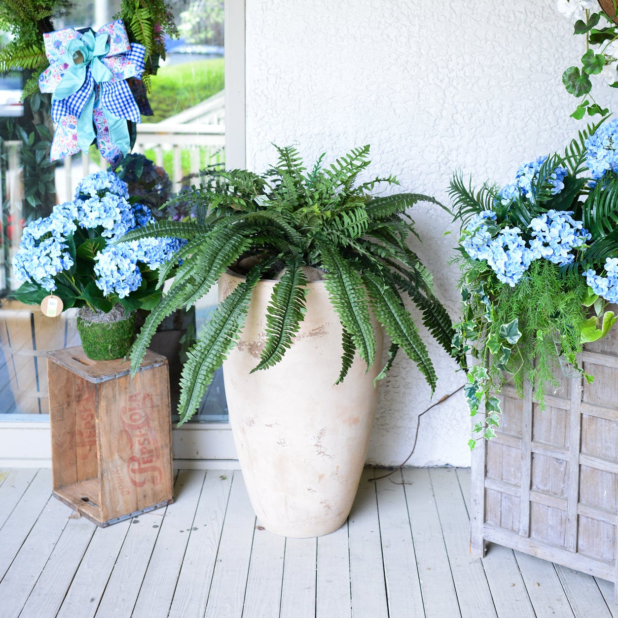 Decorative outdoor setting with potted plants and flowers on a wooden deck on Hilton Head Island, South Carolina. Bluffton, Ridgeland, Hardeeville.