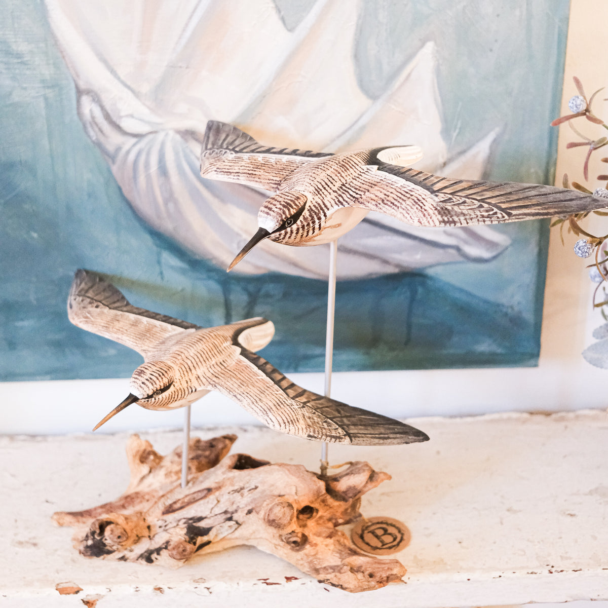 Gliding Sandpipers on Driftwood