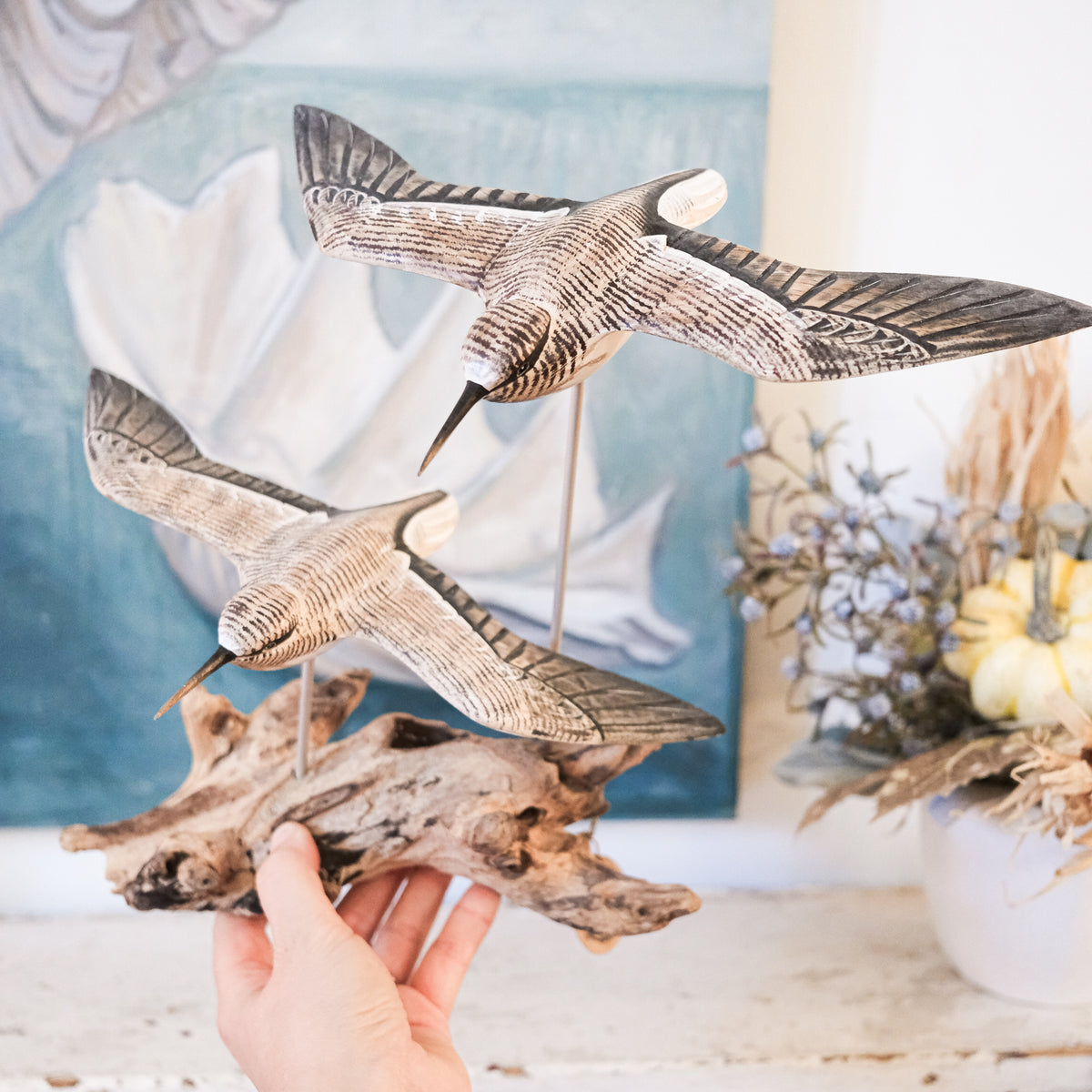 Gliding Sandpipers on Driftwood