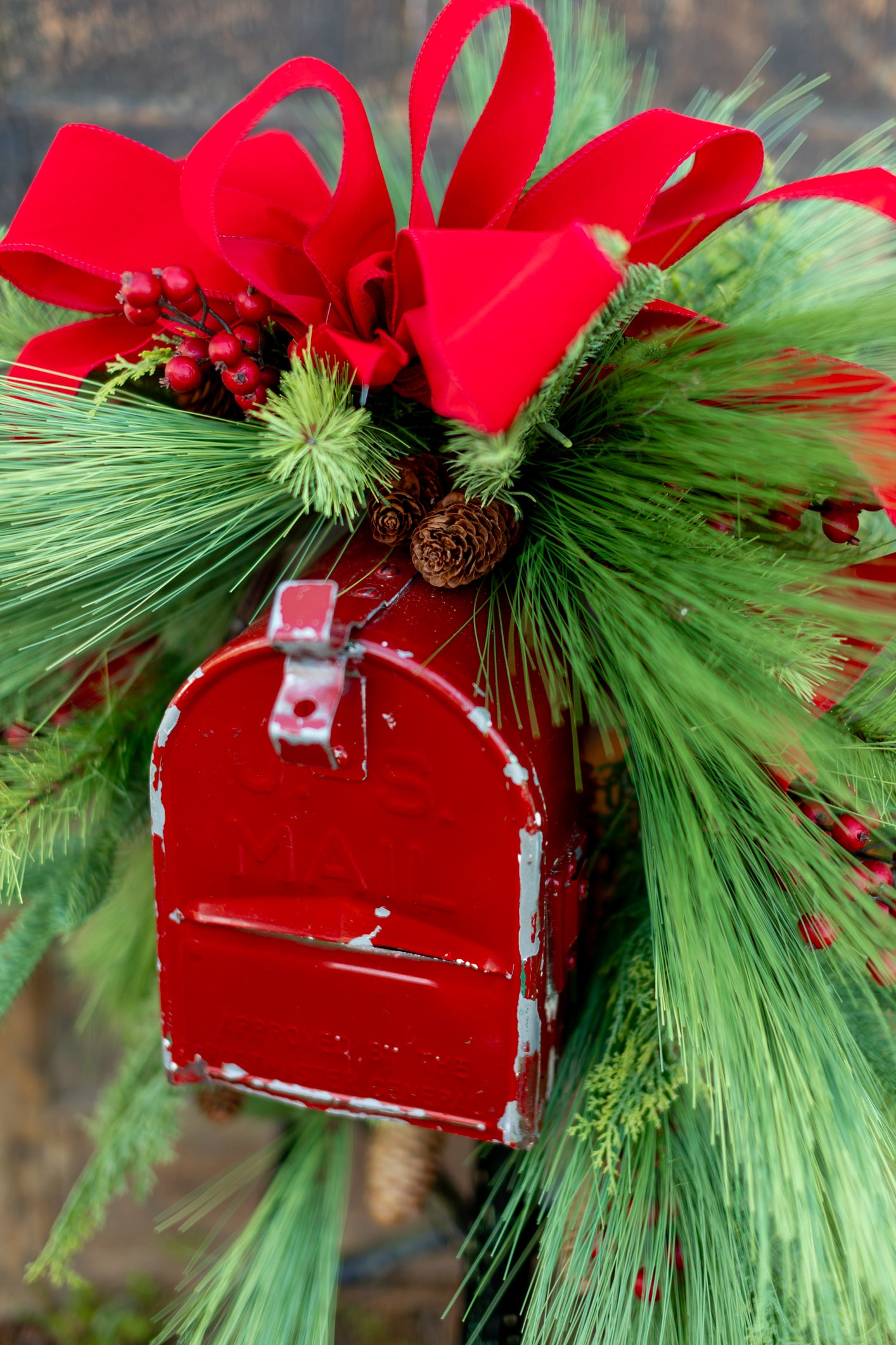 Decorated Outdoor Swag with Berries, Pine and Velvet Ribbon