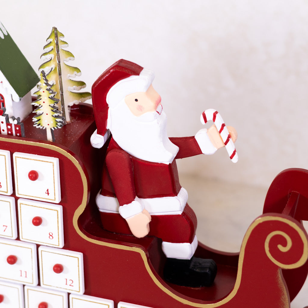 Santa in Sleigh with LED House Scene Wood Advent Calendar