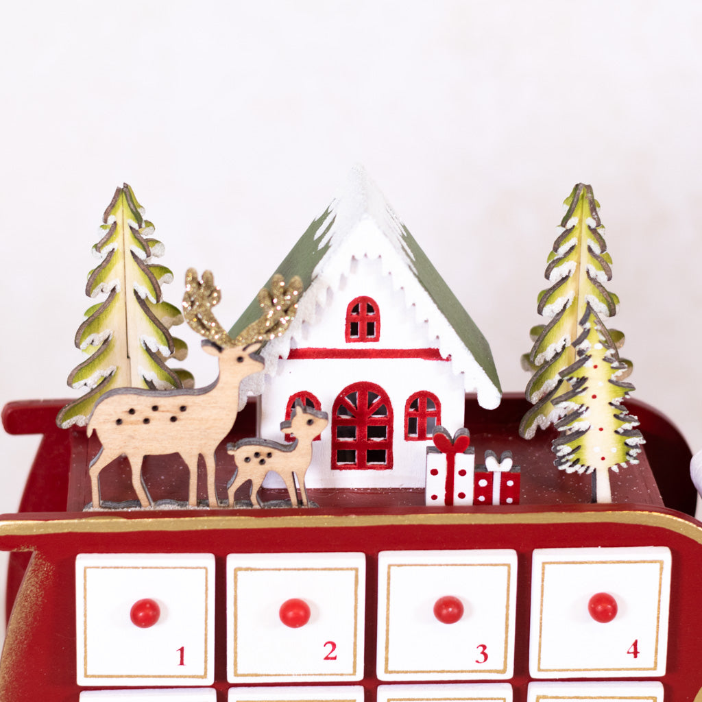 Santa in Sleigh with LED House Scene Wood Advent Calendar