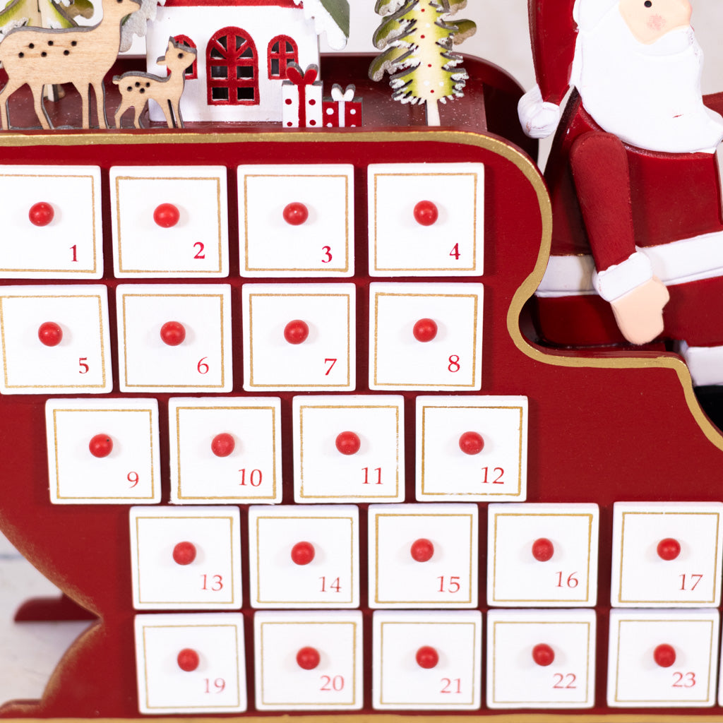Santa in Sleigh with LED House Scene Wood Advent Calendar
