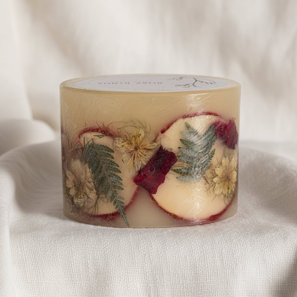 Cylindrical soap with natural elements on a white background