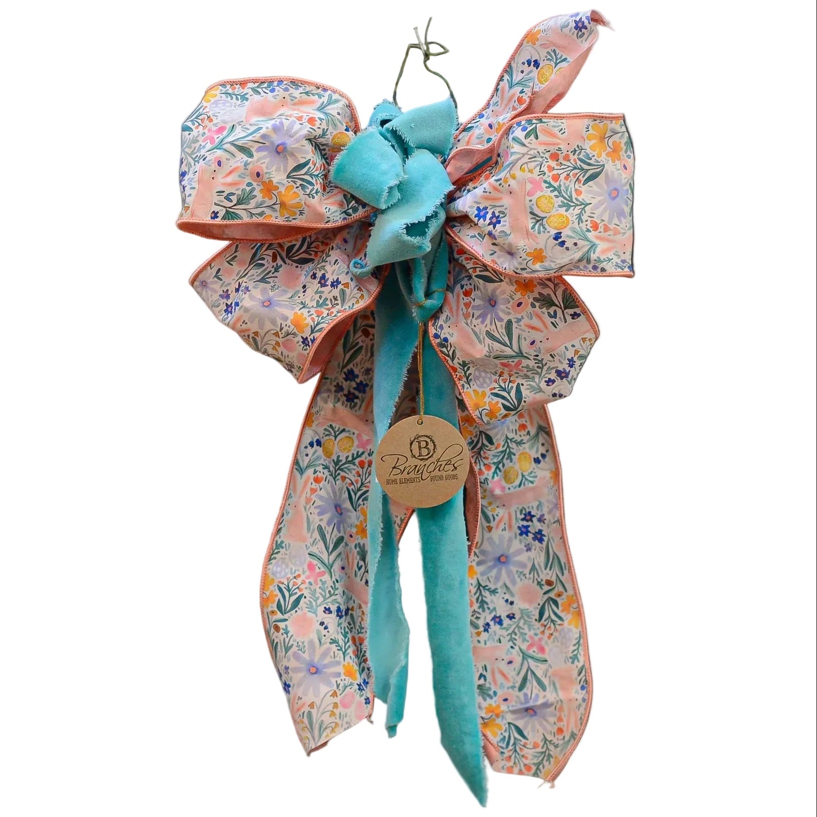 Decorative bow with floral patterns and a turquoise center on a white background