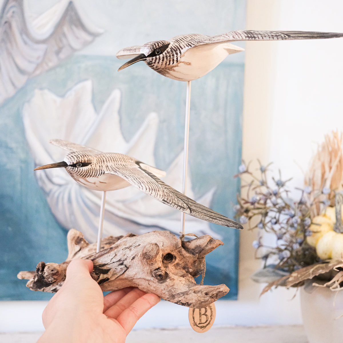 Gliding Sandpipers on Driftwood