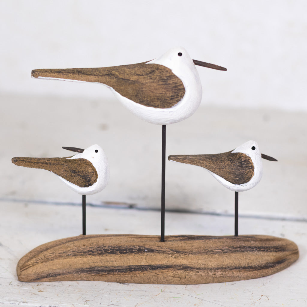 Three Seagulls on Driftwood