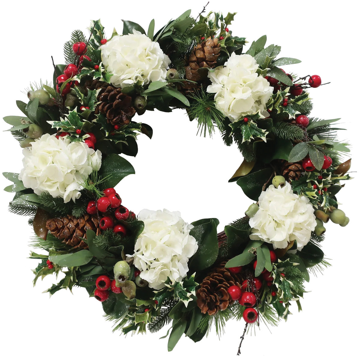 Christmas wreath with greenery, white flowers, red berries, and pinecones on a white background